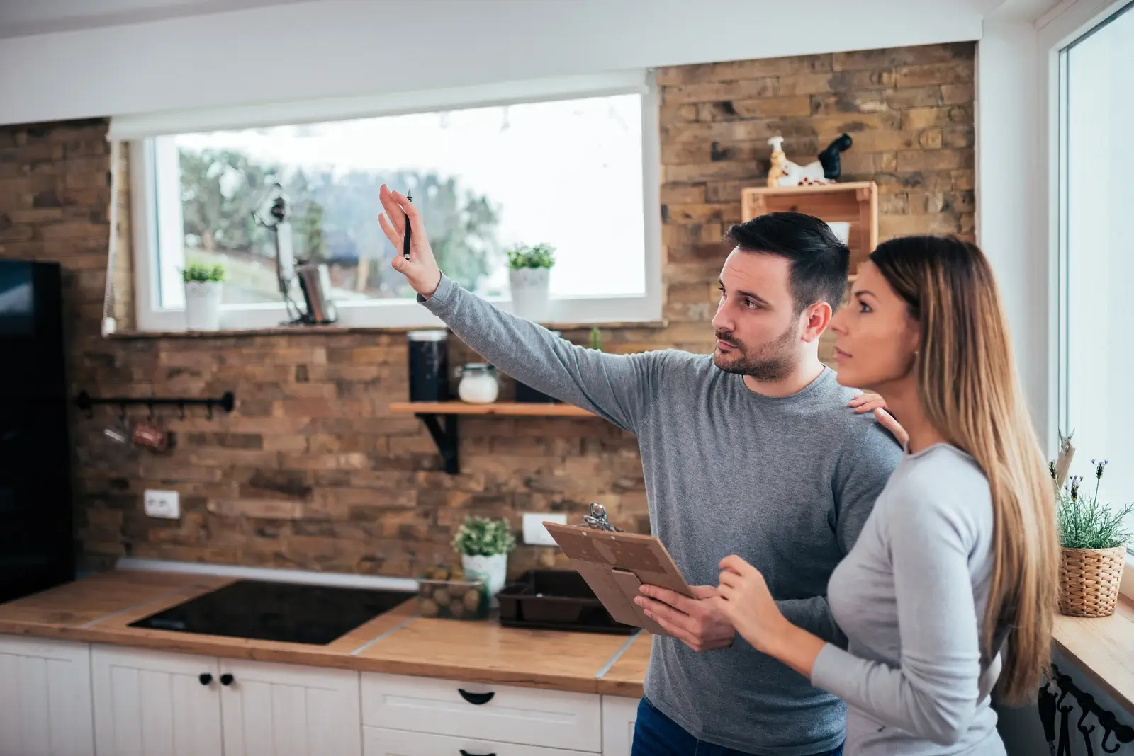 couple planning renovation works in kitchen